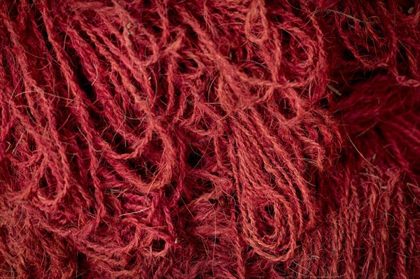 Red coloured ropes made of coconut fibres or coir