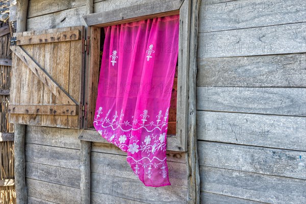 Typical house with pink curtain