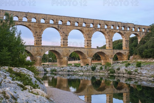 Pont du Gard Roman aqueduct over Gard River in evening light