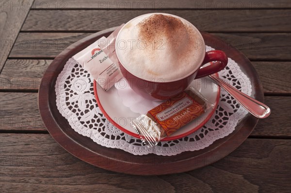 Cup of cappuccino on a wooden table