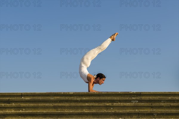 Young woman practising Hatha yoga