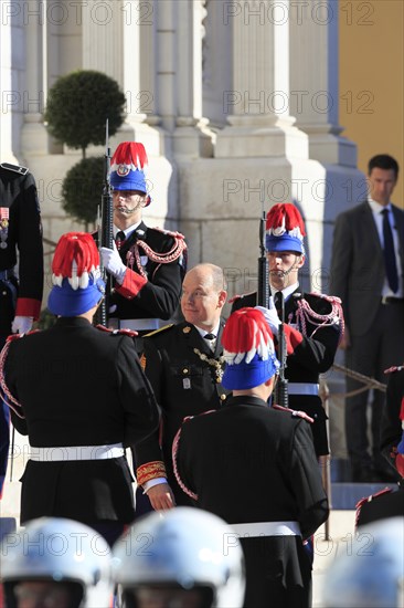 Prince Albert II. of Monaco between the Palace Guards in front of the cathedral on Fete du Prince national holiday