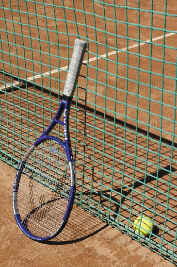 Tennis racket next to net