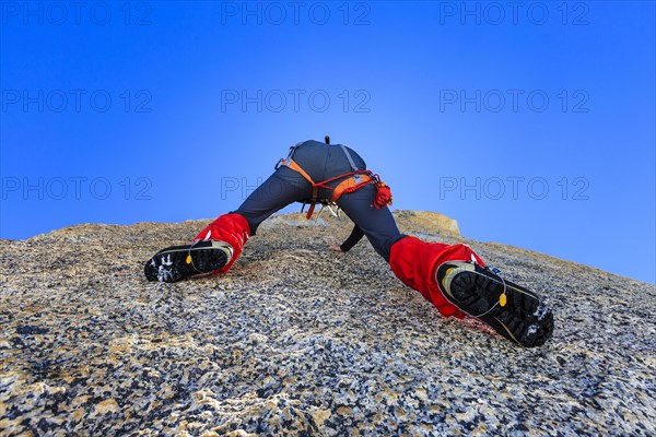 Climber climbing on a rock wall