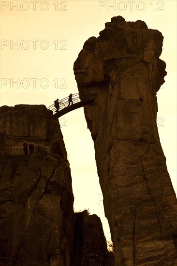 Two people on a bridge