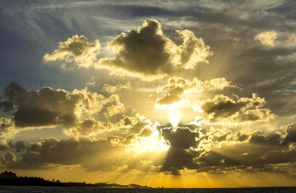 Cumulus clouds at sunset over the sea