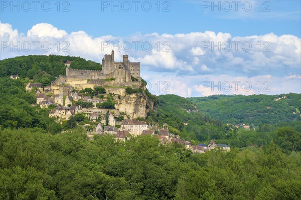 Chateau of Beynac-et-Cazenac castle and town overlooking Dordogne River valley