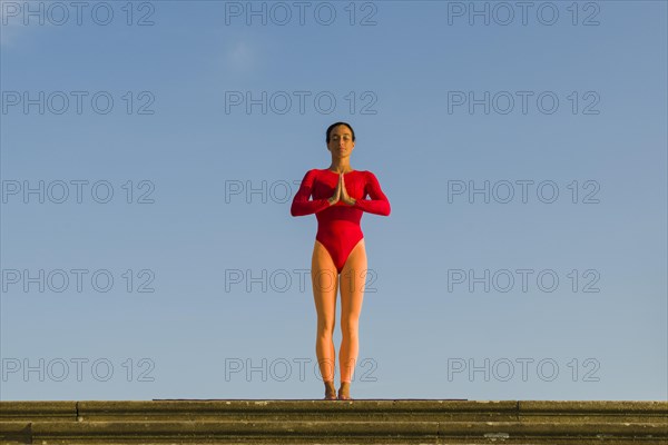 Young woman practising Hatha yoga