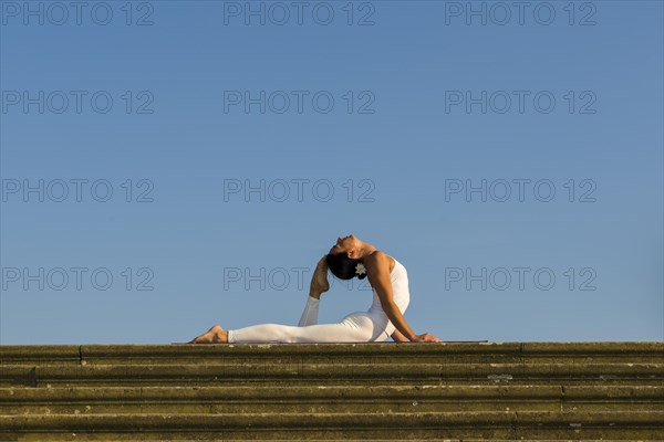 Young woman practising Hatha yoga