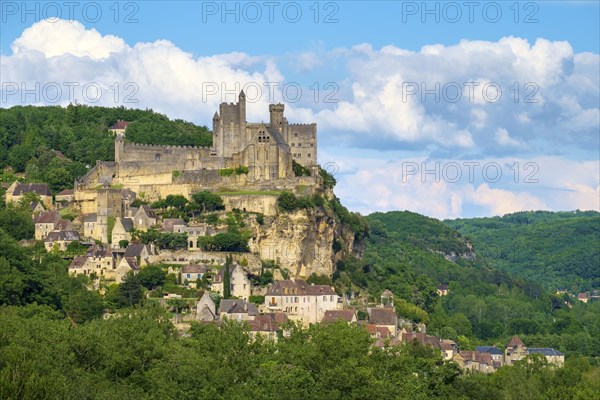 Chateau of Beynac-et-Cazenac castle and town overlooking Dordogne River valley