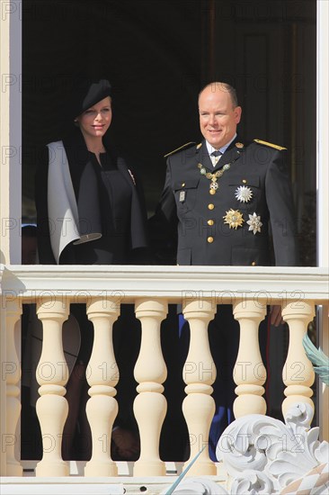 Princess Charlene and Prince Albert II. of Monaco at the Prince's Palace on Fete du Prince national holiday