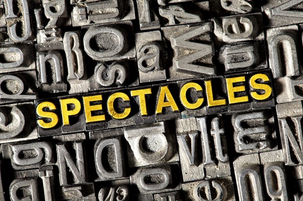 Old lead letters forming the word 'SPECTACLES'