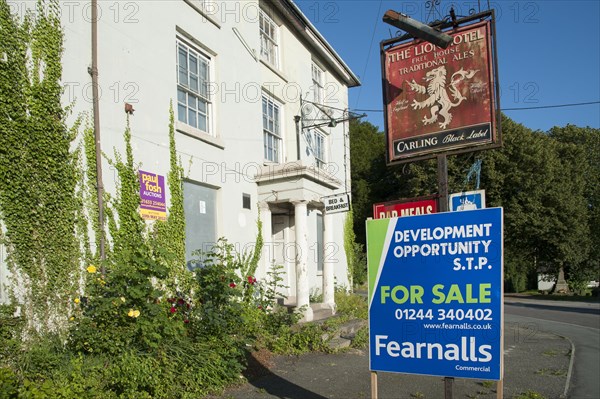 For sale' sign outside derelict public house