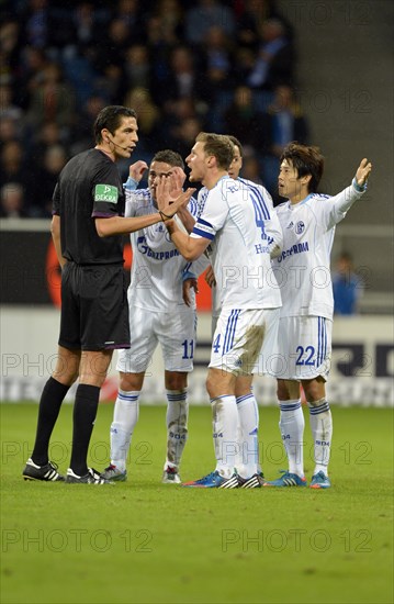 Schalke 04 players arguing with the referee Deniz Aytekin