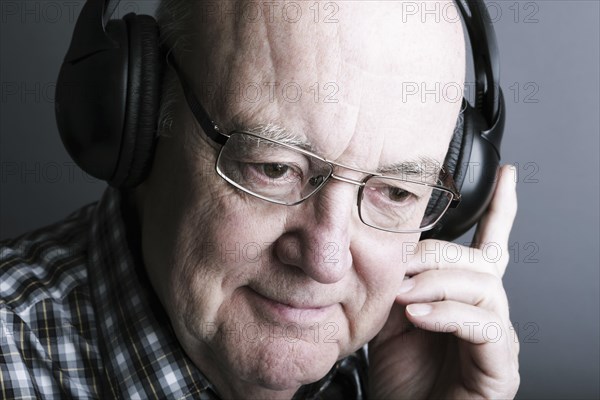 Senior wearing headphones