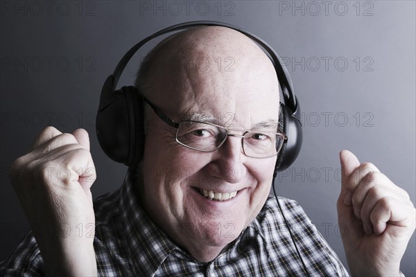 Senior wearing headphones