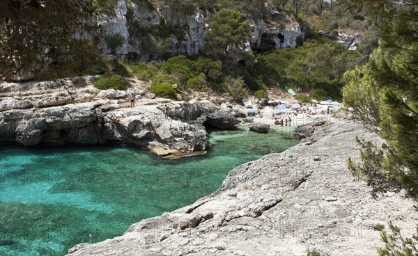 Beach in the rock-lined bay of Calo des Moro