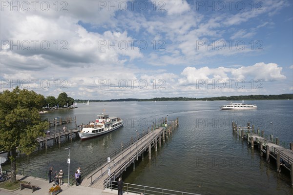 A steamboat at a landing stage on lake Chiemsee