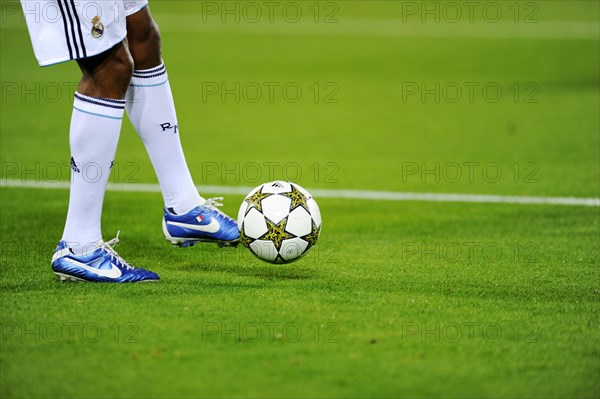 Real Madrid player running after the official match ball