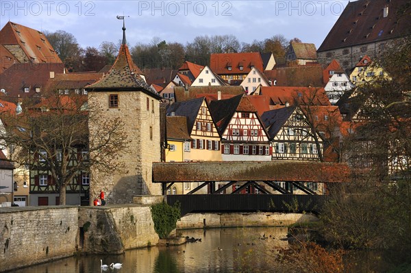Overlooking the historic town centre of Schwabisch Hall with Sulferturm tower and the Sulfersteg covered wooden footbridge crossing the Kocher River