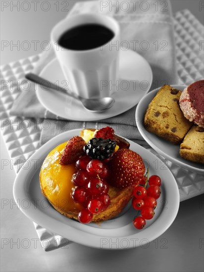 A modern fruit cake with redcurrants