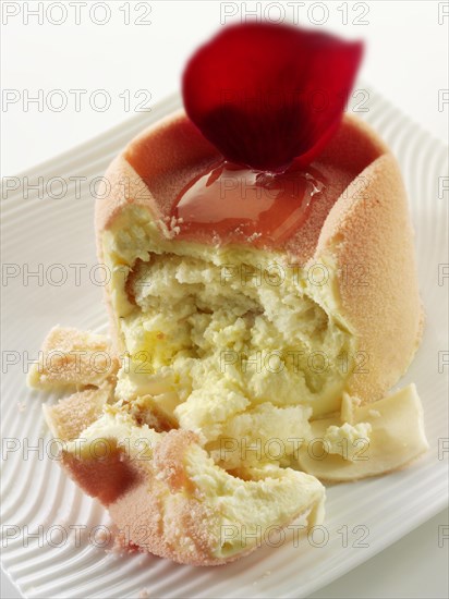 White chocolate cake with a sponge case and strawberry filling