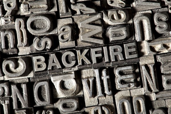 Old lead letters forming the word 'BACKFIRE'