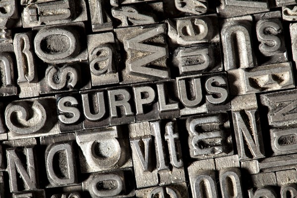 Old lead letters forming the word 'SURPLUS'