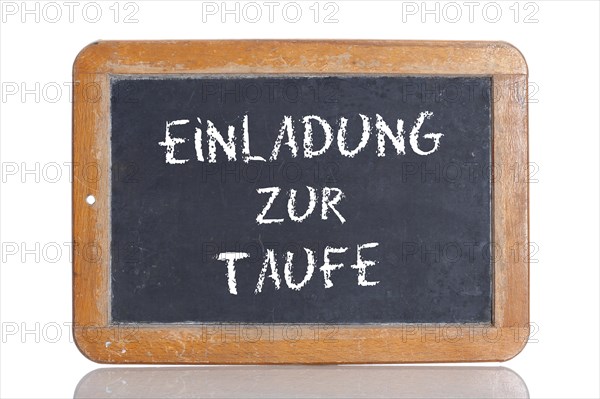 Old school blackboard with the words EINLADUNG ZUR TAUFE