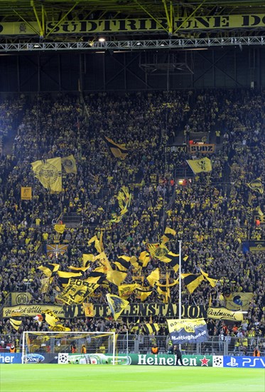 BVB fans in the south stand waving their flags before the start of the game