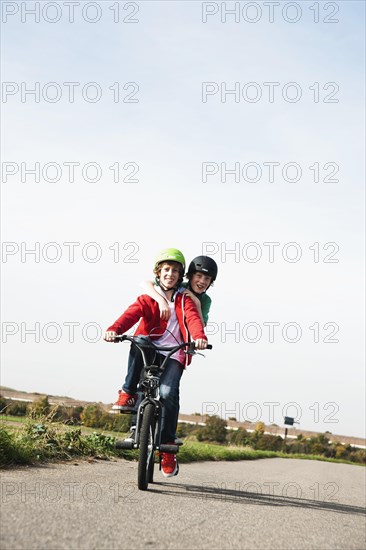 Two cool boys on a BMX bike