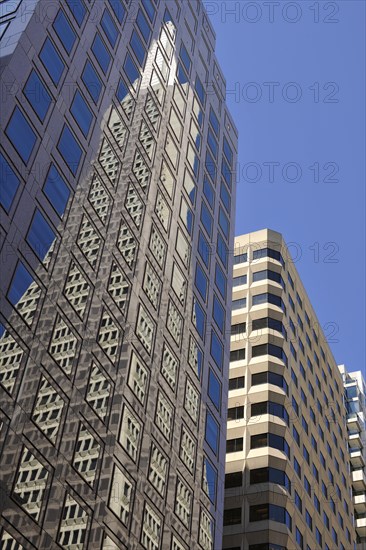 Reflection of the Transamerica Pyramid skyscraper in the East West Bank high-rise