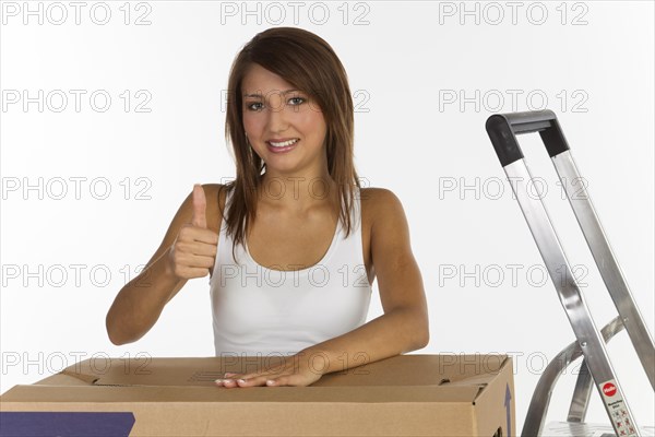 Young woman with a moving box