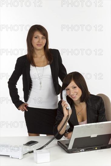 Two young women in an office