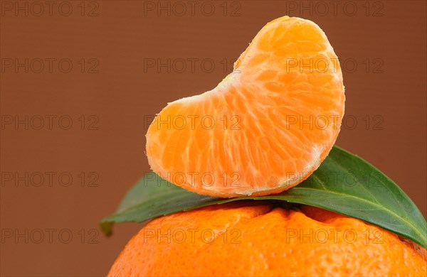 Piece of mandarine on a mandarine