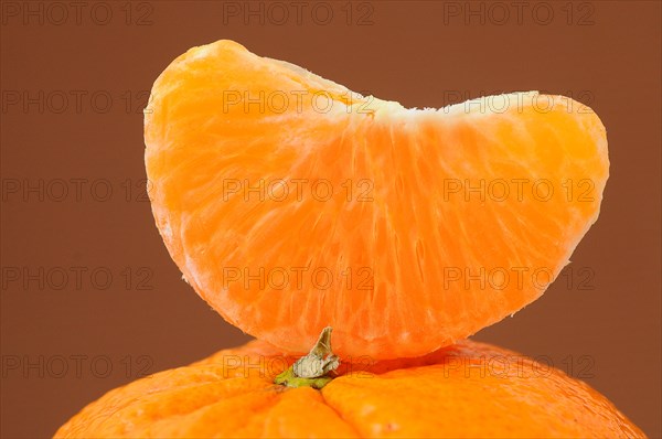 Piece of mandarine on a mandarine