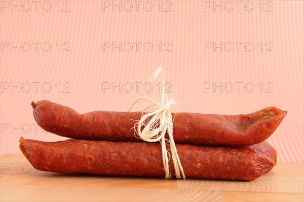 Two salami tied together