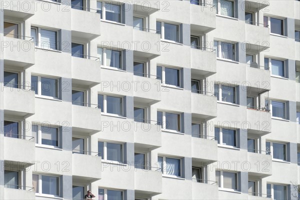 Monotonous house facade with balconies on a white residential house