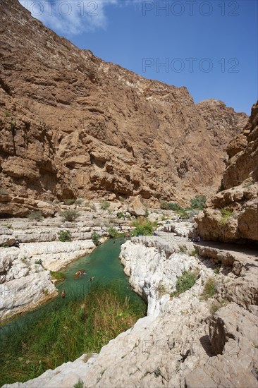 Freshwater pool between rugged cliffs