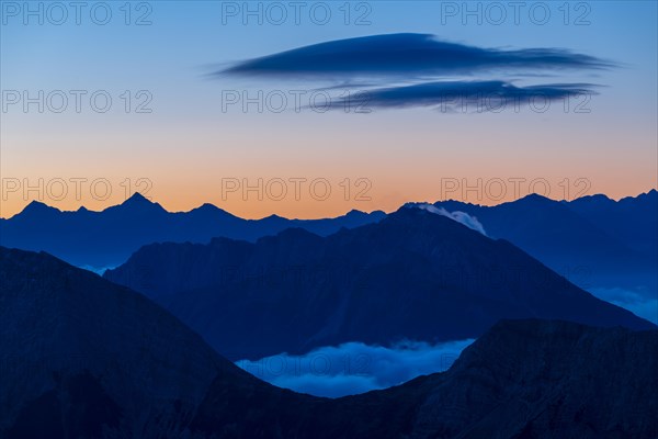 Sunrise over Lechtal Alps with fog in the valley