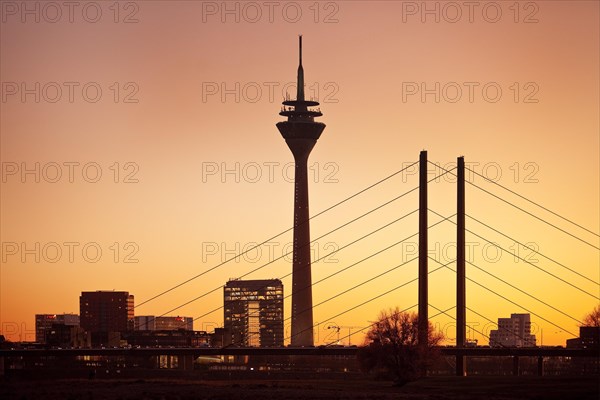 Silhouette at sunset with city gate