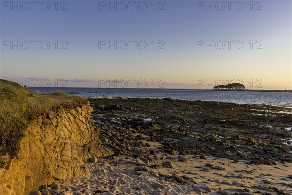 Coast in evening light with Pointe er Hourel in the background