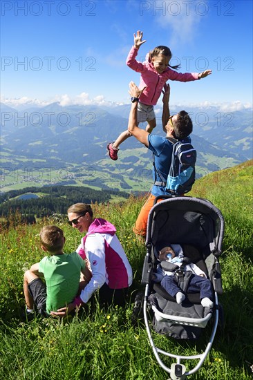 Family hiking on the summit panorama trail of the Hohe Salve