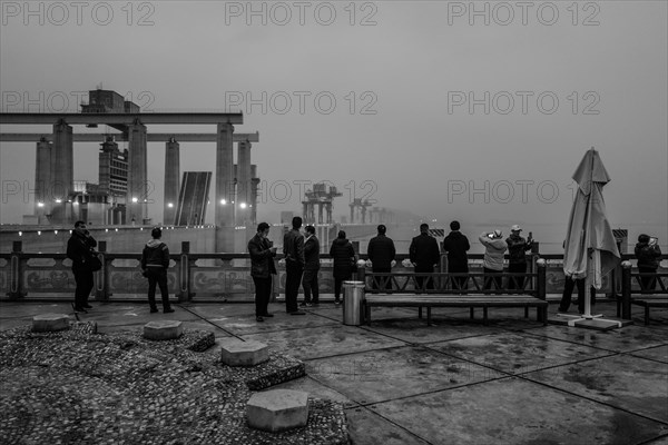 Chinese tourists on the dam of the power plant at the Three Gorges Reservoir