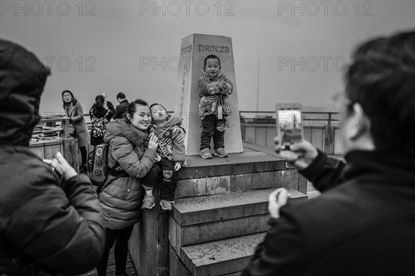 Chinese tourists on the dam of the power plant at the Three Gorges Reservoir