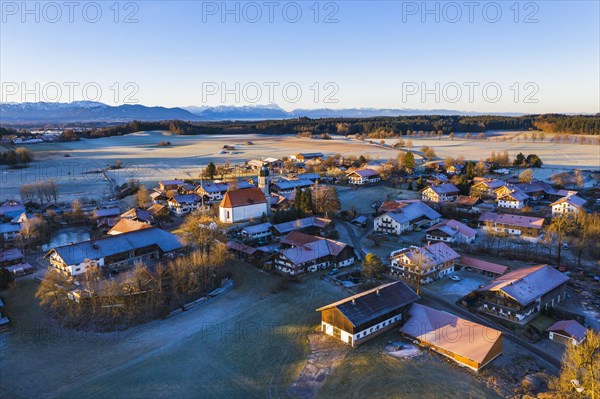 Village Lochen with church St. Magdalena in the morning light