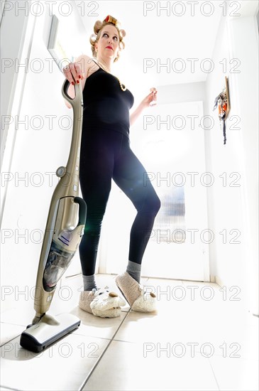 Woman vacuum cleaning