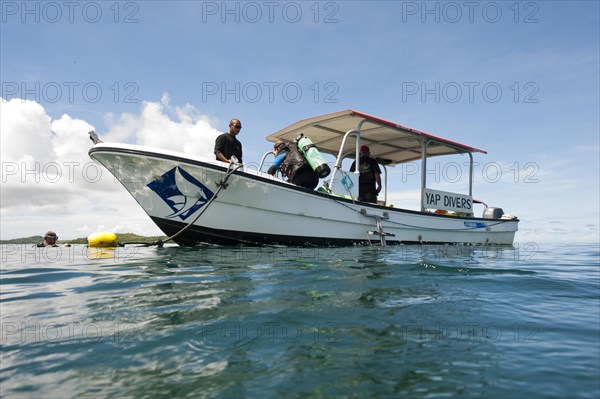 Diver in water at the dive boat