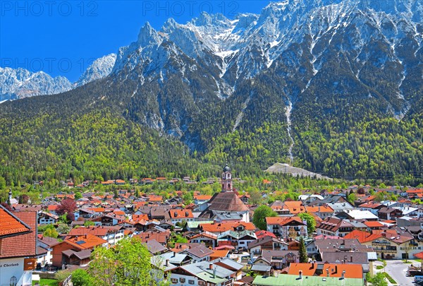 View of the town in front of the Karwendel Mountains with Viererspitze