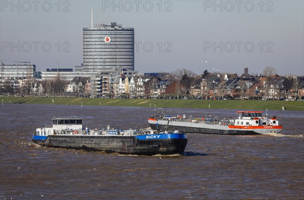 Freighters navigating on the Rhine during floods